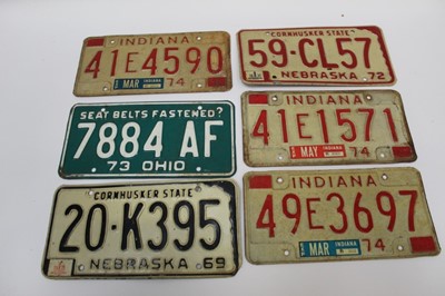 Lot 2045 - Twelve vintage American car licence plates in wooden box.