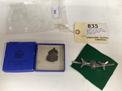 Lot 703 - Second World War American silver sweetheart brooch in the form of a bomber with rotating propellers, marked sterling, together with a Second World War ARP badge in box (2)