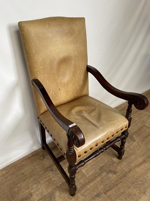 Lot 141 - Leather upholstered oak scroll armchair