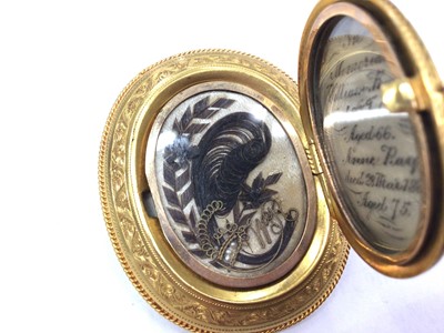 Lot 158 - Good quality Victorian yellow metal mourning brooch with Gothic engraved decoration, locket front with two panels of coiled hair, seed pearl and gold wire binding, engraved ivory panel commemoratin...