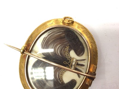 Lot 158 - Good quality Victorian yellow metal mourning brooch with Gothic engraved decoration, locket front with two panels of coiled hair, seed pearl and gold wire binding, engraved ivory panel commemoratin...