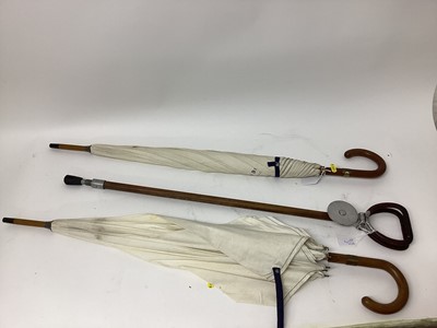 Lot 2504 - Two Dunhill umbrellas, made for the Queen's Cup 1996, together with a shooting stick