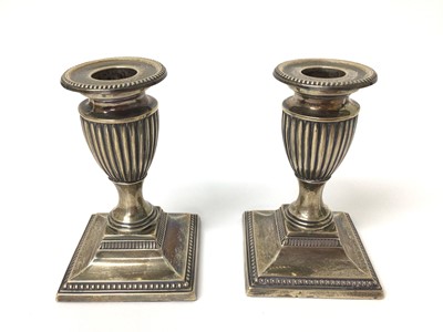 Lot 161 - Pair Victorian silver Adam-style squat candlesticks on square bases ( London