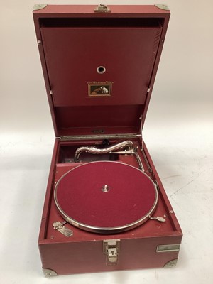 Lot 2211 - HMV portable wind up gramophone in red, with a bag of singles and a folder of 78s