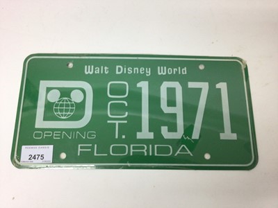 Lot 2475 - Rare Walt Disney memorabilia - a Walt Disney World license plate with the opening date Oct 1971, still in original wrapping, bought at the opening by the vendor