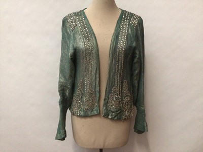 Lot 2113 - Art Deco evening jacket heavily decorated with paste stones and tiny glass beads, silk lined.