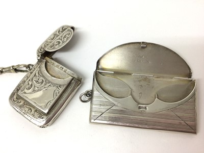 Lot 175 - Edwardian silver combination vesta and stamp case with floral engraved decoration ( Birmingham1906) 4.5 cm and silver envelope stamp case (Birmingham 1912) 6cm (2)