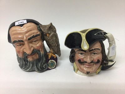 Lot 1185 - Six Royal Doulton character jugs - Merlin D6529, Capt Henry Morgan D6467, Capt Ahab D6500, Robinson Crusoe D6532, Sancho Panca D6456 and Monty D6202