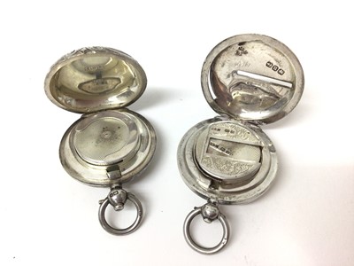 Lot 179 - Two Edwardian silver sovereign cases with engraved decoration