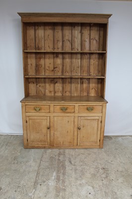 Lot 127 - Victorian two height pine dresser, the upper open shelves above three drawers and twin panelled doors below, 148cm wide x 230cm