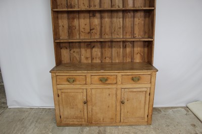 Lot 127 - Victorian two height pine dresser, the upper open shelves above three drawers and twin panelled doors below, 148cm wide x 230cm