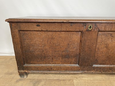 Lot 128 - 18th century oak coffer of typical form with panelled front, on block feet, 126cm wide x 45cm deep x 53cm high