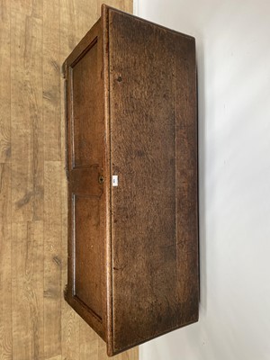 Lot 128 - 18th century oak coffer of typical form with panelled front, on block feet, 126cm wide x 45cm deep x 53cm high