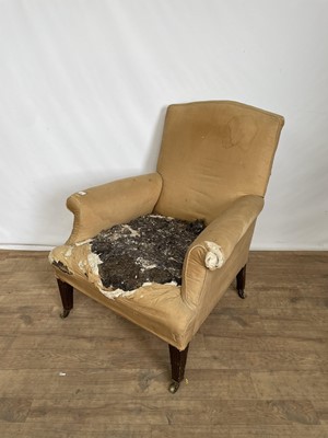 Lot 130 - 19th century armchair in need of re-upholstering, on tapered fluted mahogany legs terminating on brass castors