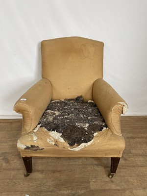 Lot 130 - 19th century armchair in need of re-upholstering, on tapered fluted mahogany legs terminating on brass castors