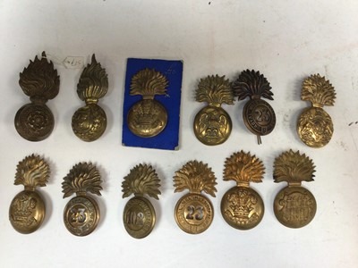 Lot 730 - Group of twelve Victorian and later Royal Welsh Fusilier, Royal Madras Fusilier and other regimental badges (some copies noted)