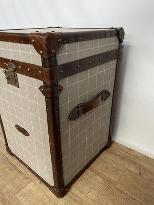 Lot 133 - Contemporary leather bound fabric covered trunk of cube form, 42cm square x 61cm high