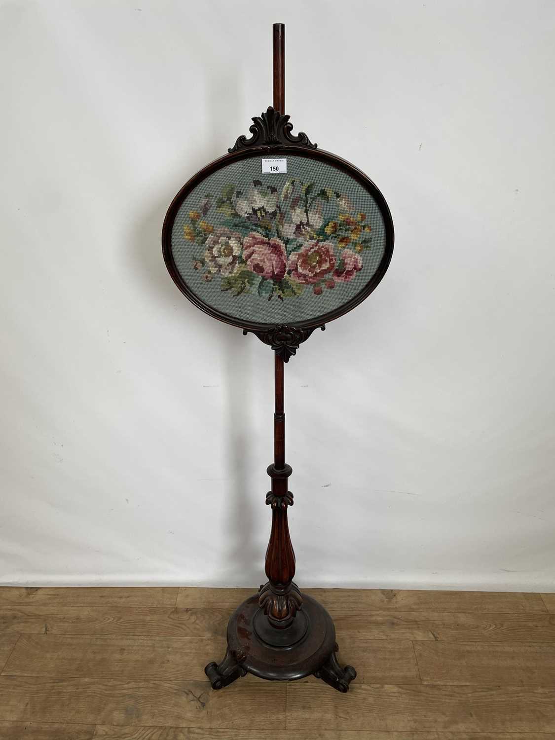 Lot 150 - Victorian rosewood polescreen with inverted tulip carved column, 135cm high