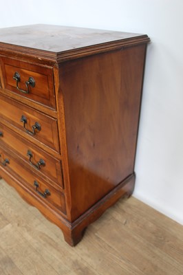 Lot 152 - Small reproduction yewwood chest of two short and three long drawers, 63cm wide x 40cm deep x 72cm high