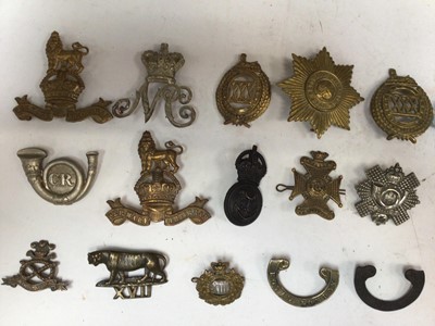 Lot 733 - Group of twenty eight Victorian and later miltary badges to include Cambridgeshire Regiment, Lincolnshire Regiment and Bedfordshire Regiment (some copies noted) (28)