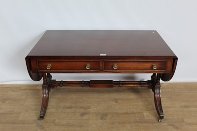 Lot 156 - Regency-style low sofa table with twin flaps and two drawers, on splayed legs, 102cm wide x 62cm deep x 56cm high