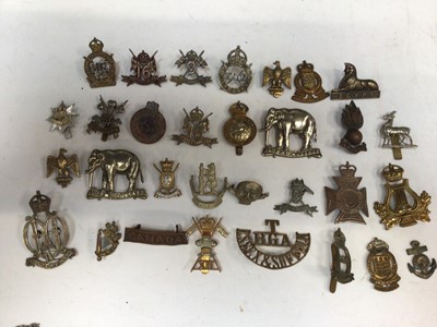 Lot 734 - Group of sixty plus Victorian and later military cap badges including The Essex Regiment (some copies noted)