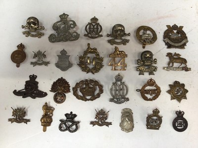 Lot 735 - Group of fourty Victorian and later military cap badges including Shropshire Yeomanry, Royal Artillery and others (some copies noted) (40)