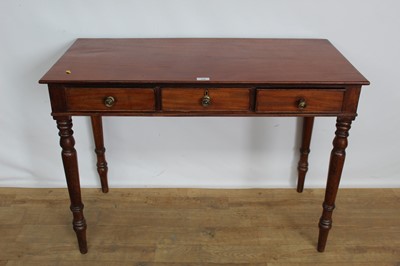 Lot 158 - Late 19th century mahogany side table with three drawers, on turned legs, 102cm wide x 48cm deep x 74cm high
