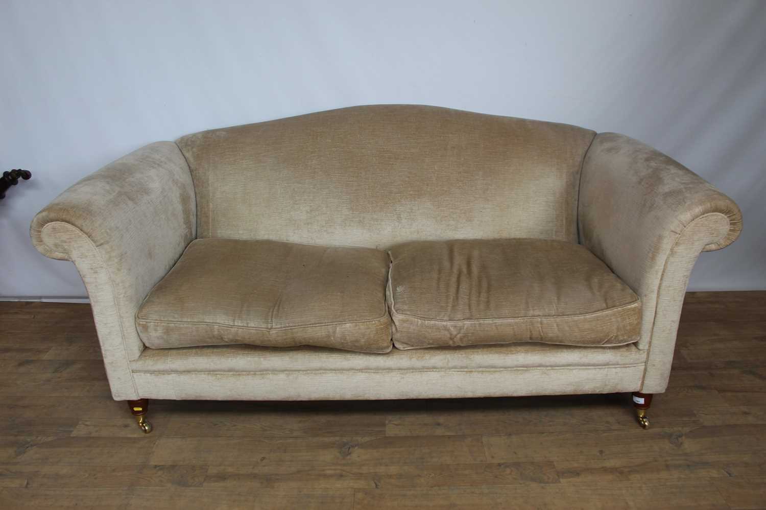 Lot 161 Contemporary camel back sofa on brass