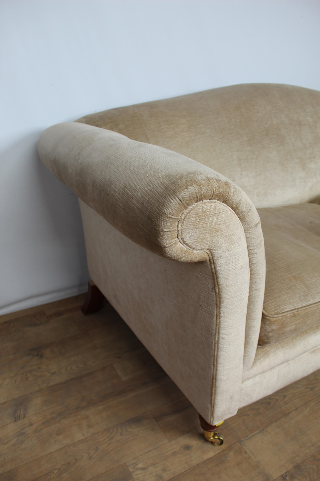 Lot 161 Contemporary camel back sofa on brass