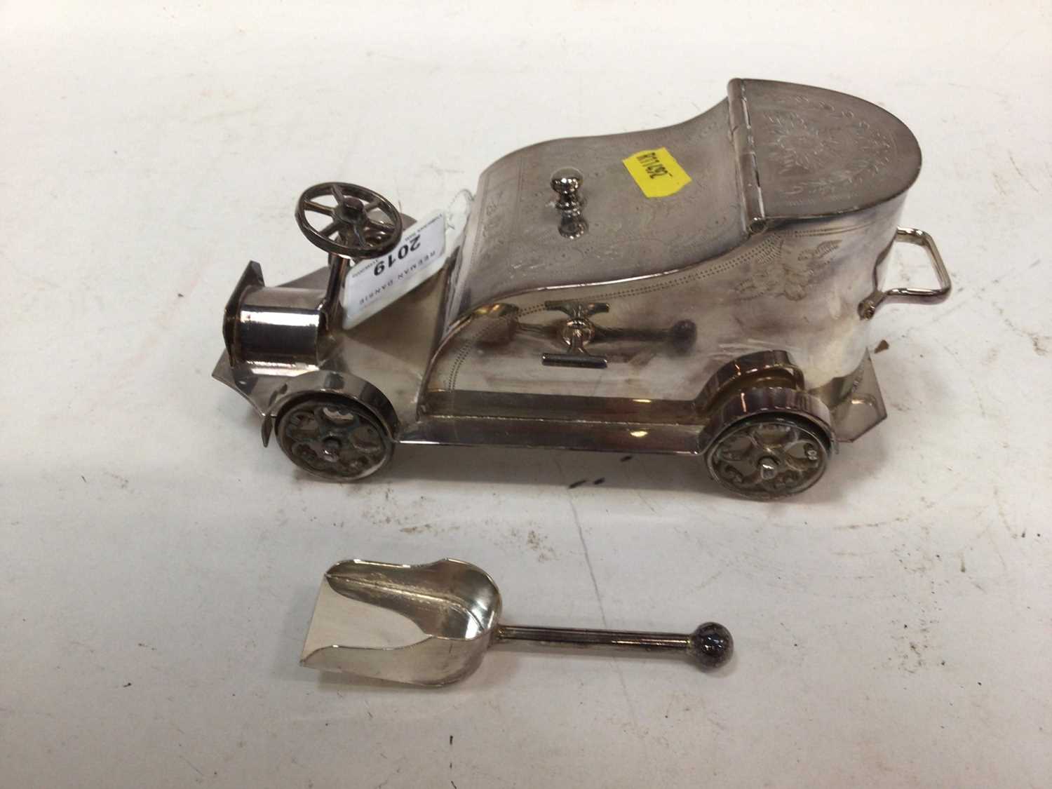 Lot 2019 - Early 20th century silver plated sugar bowl or caddy in the form of a vintage car with engraved decoration, marked to underside 'Superior Electro plated, made in England'; 18cm in length.