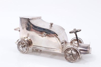 Lot 2019 - Early 20th century silver plated sugar bowl or caddy in the form of a vintage car with engraved decoration, marked to underside 'Superior Electro plated, made in England'; 18cm in length.