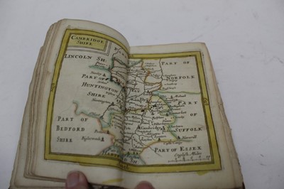 Lot 1442 - Maps, an 18th century bound volume of hand coloured engraved maps by John Seller, lacking front cover and frontispiece, containing 62 folding maps of The Bristish Isles, view of Stonehenge, Seals o...