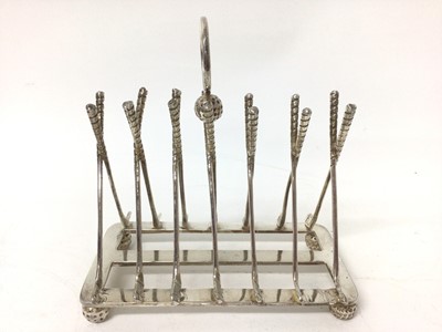 Lot 200 - 1930s American novelty silver plated golfing toast rack with golf club divisions and golf ball feet 15.5 cm long