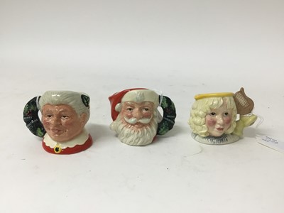 Lot 1220 - Seven Royal Doulton character jugs - Santa Claus D6900, Mrs Claus D6922, Snowman D6972, Elf D6942, The Angel D7051, The Caroler D7007 and Snowman D7962