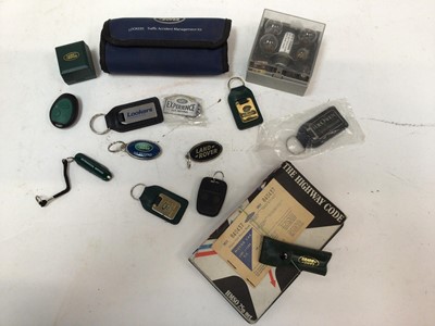 Lot 1988 - Collection of Land Rover related items to include pin badges, OEM key cases, tax disc holders and key rings (1 box)