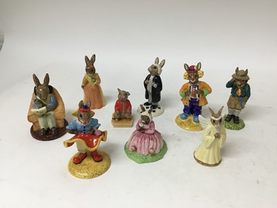 Lot 1222 - Nineteenth Royal Doulton Bunnykins figures including Clarence The Clown, Randolph The Ringmaster, Sandcastle Money Box, Merlin, Postman etc