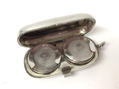 Lot 213 - Silver double sovereign case of oval form (Birmingham 1912, Aaron Lufkin Dennison) 6 cm