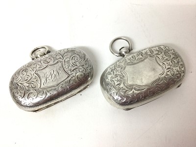 Lot 214 - Two Edwardian silver double sovereign cases with floral engraved decoration (Birmingham 1903 and 1910) both 5cm long