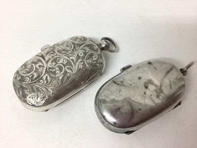 Lot 215 - Two George V silver double sovereign holders, one with floral engraved decoration (Birmingham 1912 & 1913) both 5cm long