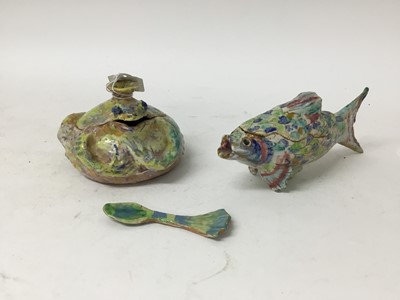 Lot 1237 - Ann Stokes studio pottery fish and toad boxes, 19cm and 10cm wide, and a spoon (3)