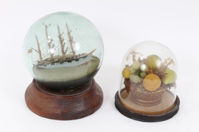 Lot 753 - Victorian wax bowl of fruit, together with a ship diorama in a glass globe