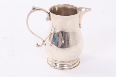 Lot 231 - 1930s silver table lighter together with a silver milk jug