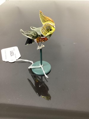 Lot 1251 - Swarovski crystal amber and grey bird of paradise on stand