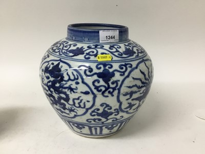 Lot 1244 - Chinese blue and white Ming-style vase, painted with a dragon and phoenix pattern, 23cm high