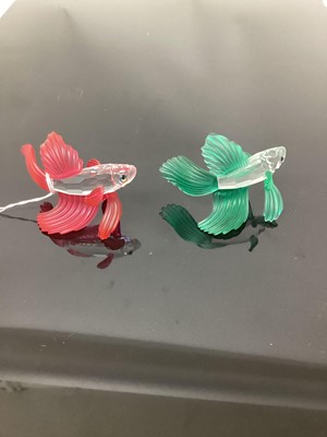 Lot 1245 - Three Swarovski crystal Siamese Fighting Fish, red, blue and green together with one other Swarovski Fish (4)