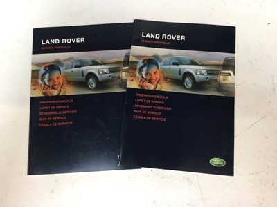 Lot 1962 - Two unused Land Rover service portfolios / books, both dated 2004 (2)