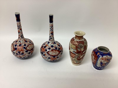 Lot 1327 - Pair of Japanese Meiji period Imari bottle vases, together with two other Japanese vases