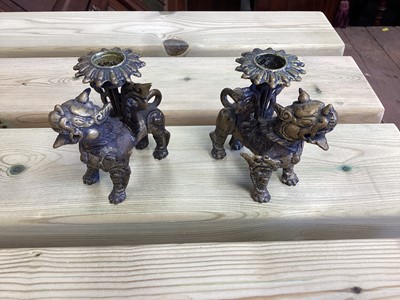 Lot 2486 - Chinese bronze censer, together with a Chinese bronze figure, a pair of Tibetan foo dog candlesticks and a pair of Japanese bronze pricket candlesticks (9)