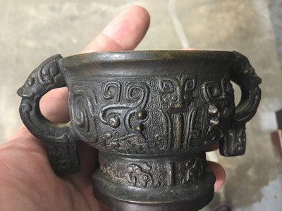 Lot 2486 - Chinese bronze censer, together with a Chinese bronze figure, a pair of Tibetan foo dog candlesticks and a pair of Japanese bronze pricket candlesticks (9)